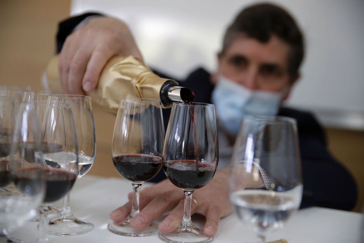 Philippe Darriet, Président of the Institute for wine and vine research and head oenologist fills glasses with wine for a blind tasting at the ISVV Institue in Villenave-d’Ornon, southwestern France. Twelve connoisseurs sampled one of the space-traveled wines, blindly tasting it alongside a bottle from the same vintage that had stayed in a cellar.